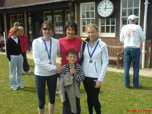 Caroline Julie and Louise collecting medals